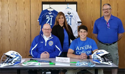 Jessee Holt signs with Ancilla College.